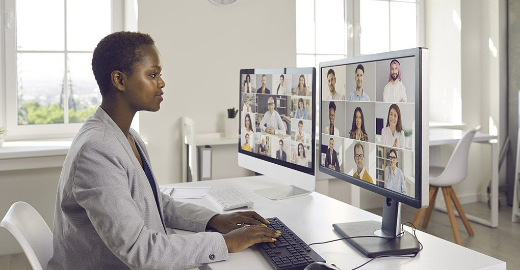 Person sitting at computer on a video conference